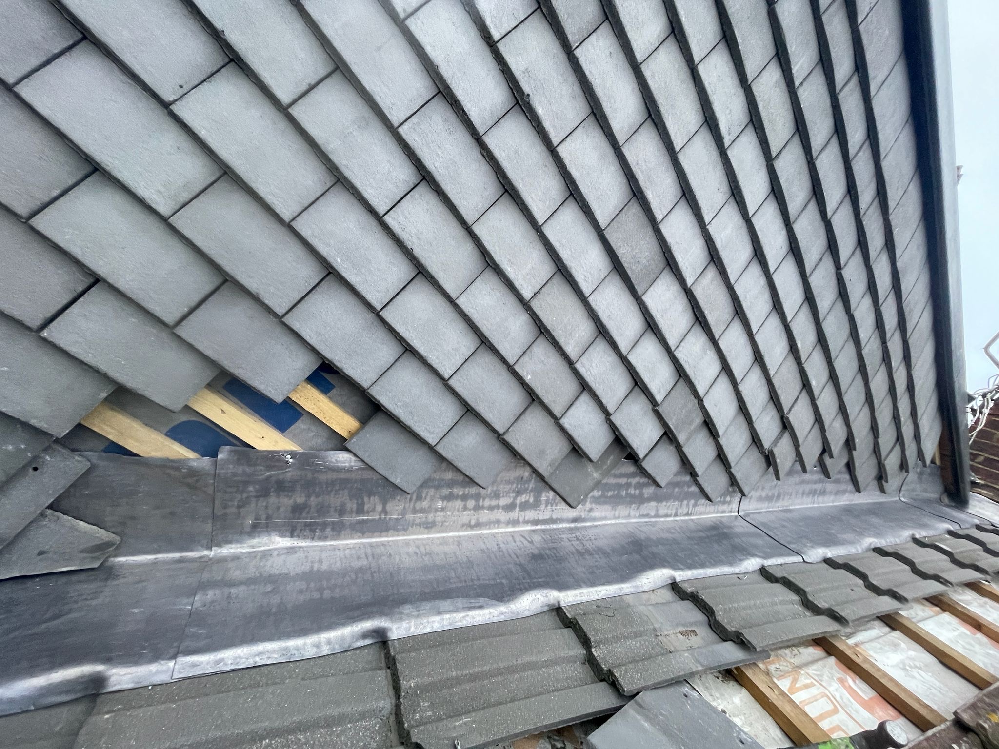 Slate roof with lead flashing